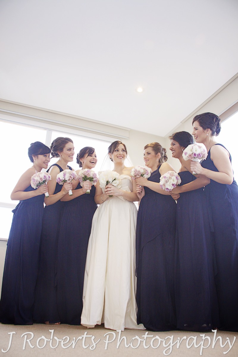 Bride laughing with bridesmaids - wedding photography sydney